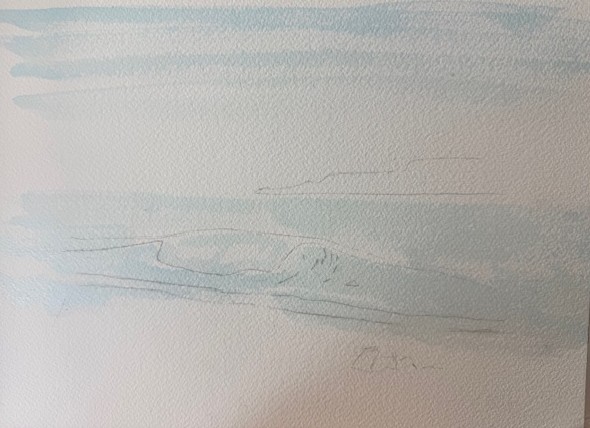 Application des premières couleurs bleues pour peindre la mer à l’aquarelle