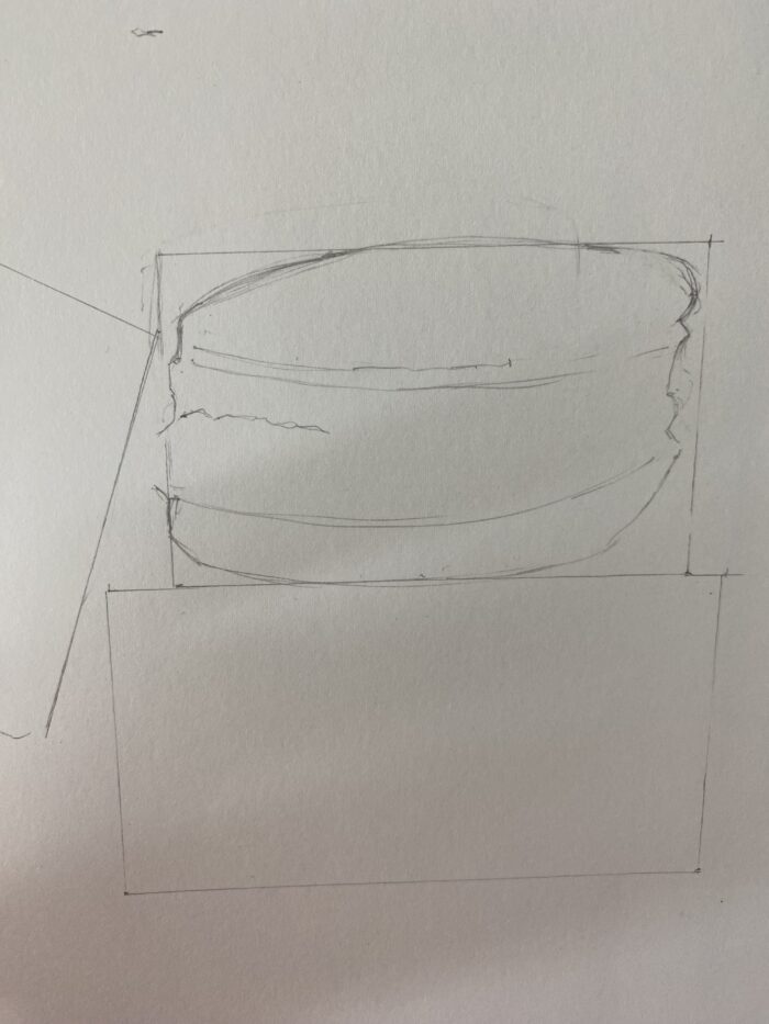 Dessin en progression : Ajout des détails d'une coque de macaron. Utilisation de crayons 2B pour les détails fins