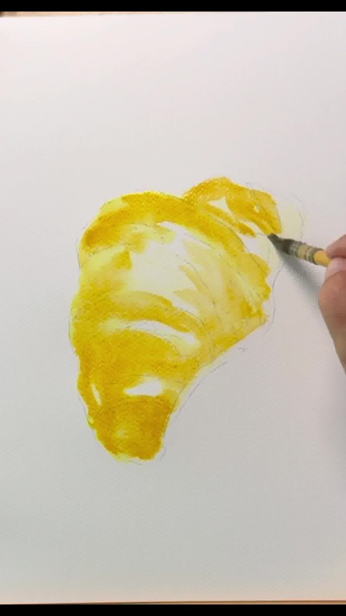 reflets blancs préservés sur un croissant peint à l'aquarelle