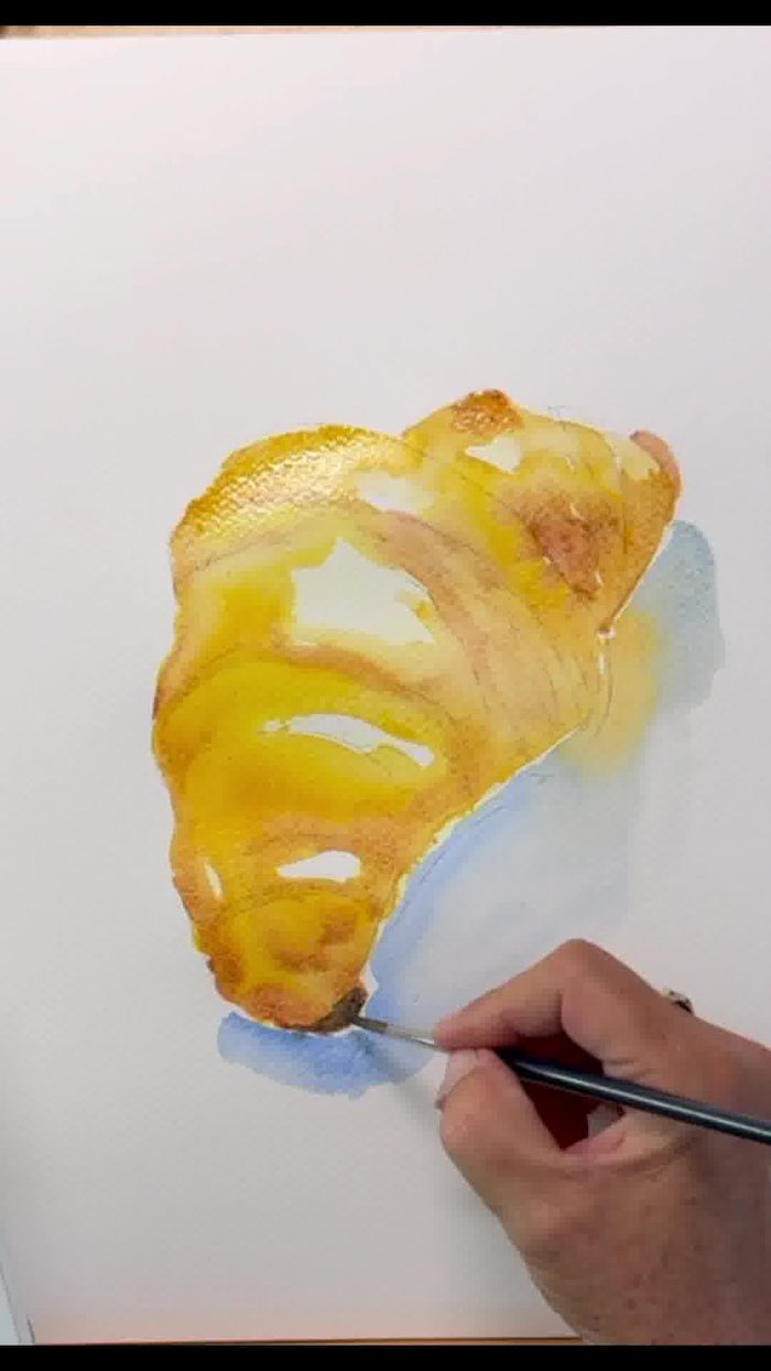 ombre portée bleutée et volume d'un croissant à l'aquarelle